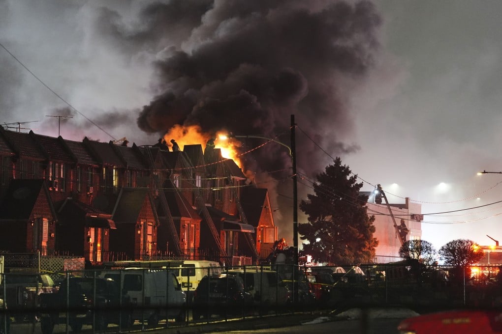 Firefighters battle flames caused by a plane crash in Philadelphia on Friday. Photo: AP