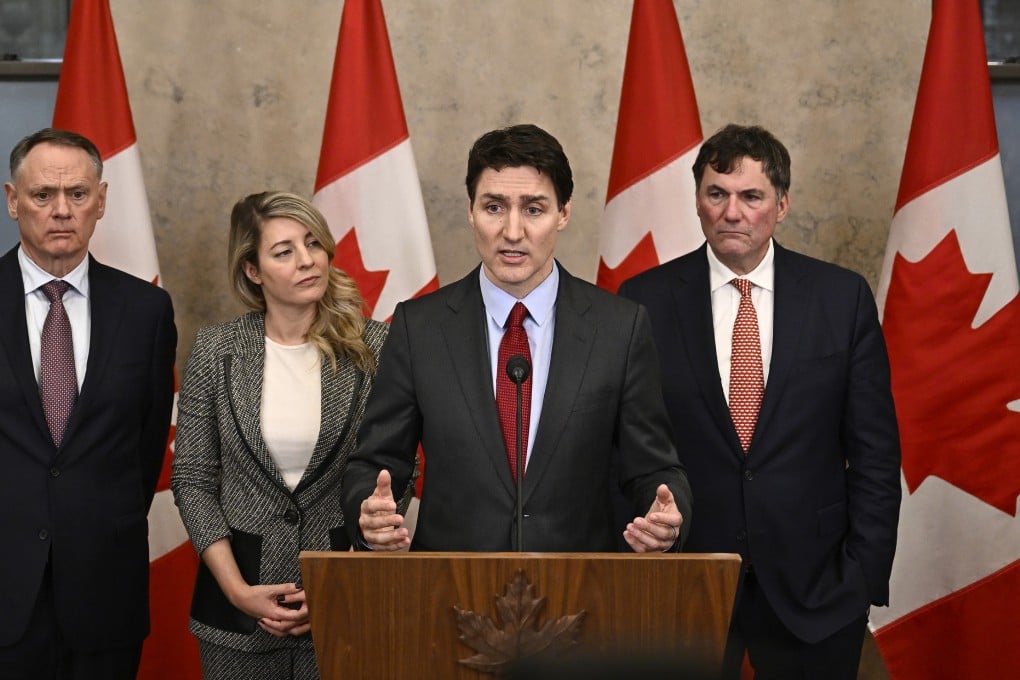 Canada’s Prime Minister Justin Trudeau (centre) addresses the media in Ottawa on Saturday following the imposition of a raft of tariffs by US President Donald Trump against Canada, Mexico and China. Photo: The Canadian Press via AP
