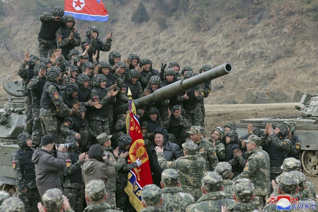 North Korean leader Kim Jong- un meets soldiers during a training in North Korea. Photo: AP