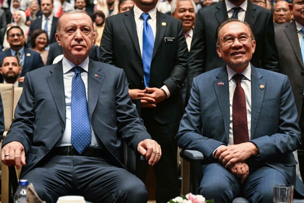 Turkey’s President Recep Tayyip Erdogan and Malaysia’s Prime Minister Anwar Ibrahim attend a public lecture in Putrajaya on Monday. Photo: AFP