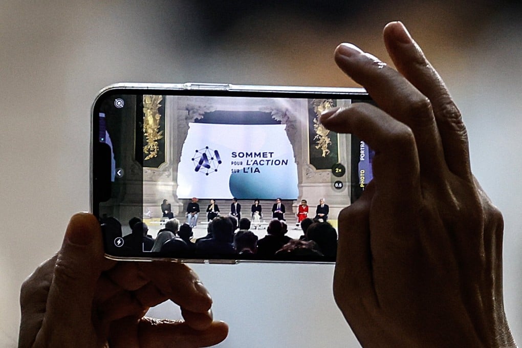 A participant takes a photo during a plenary session of the Artificial Intelligence (AI) Action Summit at the Grand Palais in Paris, France, on February 11. Photo: EPA-EFE