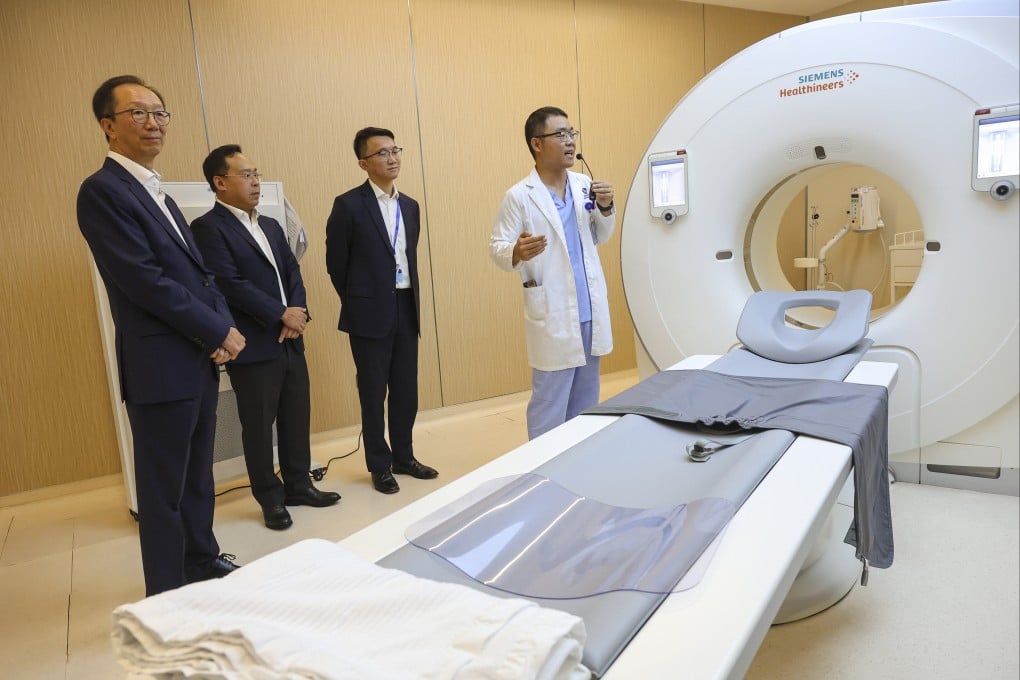 Antony Leung (left), co-founder of the New Frontier Group, joins a tour of a hospital in Shenzhen. Photo: Edmond So