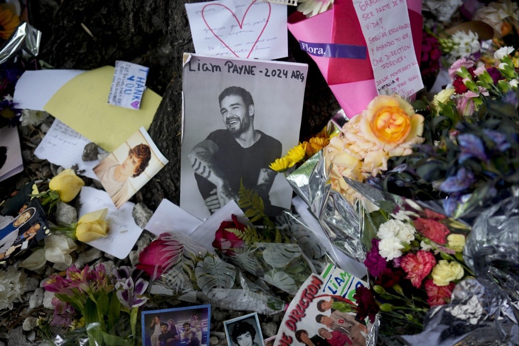 A makeshift memorial to former One Direction singer Liam Payne outside the hotel where he fell from a balcony to his death, in Buenos Aires, Argentina on October 17. On Thursday, an Argentine court dropped charges against three people tied to his death. Photo: AP