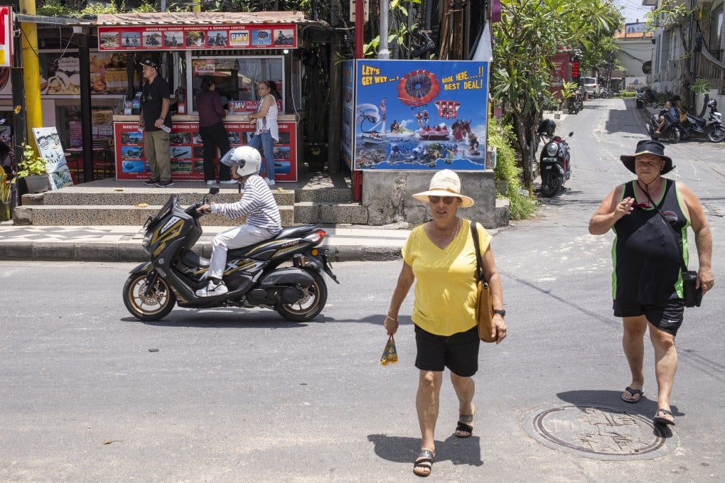 Tourists wander at Kuta Beach in Bali, Indonesia, on February 3. Photo: EPA-EFE