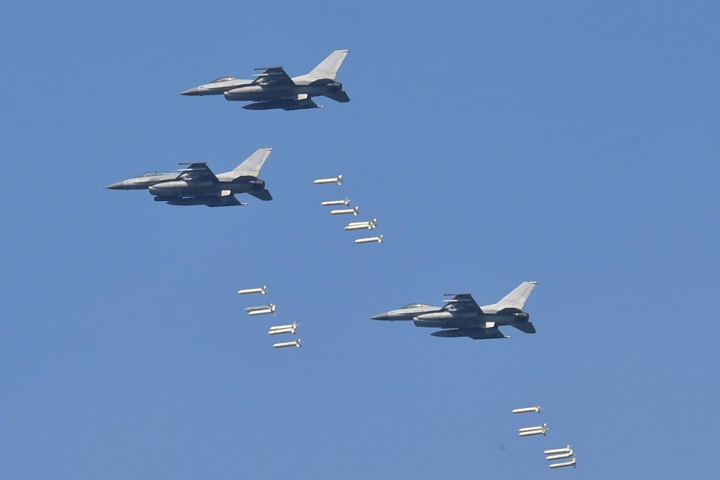South Korean fighter jets drop bombs on a mountain target during a joint live-firing drill between South Korea and the US. Photo: AFP