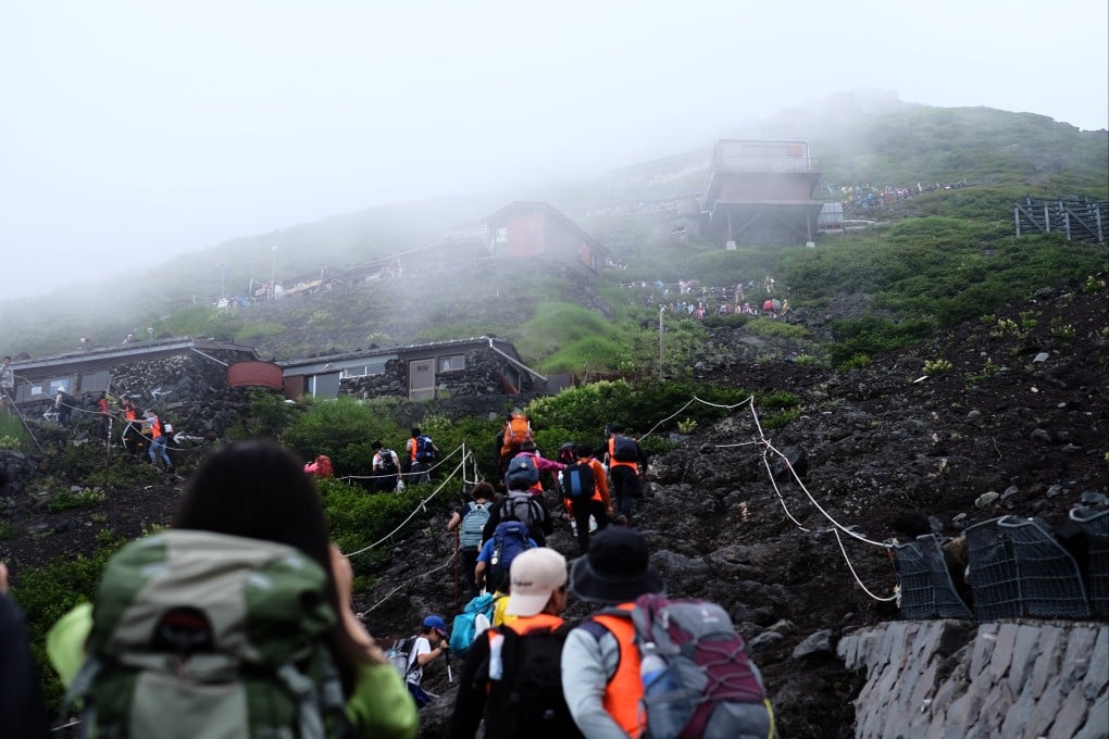 The slopes of Mount Fuji have become jammed. The fee to access any of the trails up Japan’s highest peak will double this year to the equivalent of US$27 in a move to reduce crowding at the Unesco World Heritage site. Photo: Shutterstock
