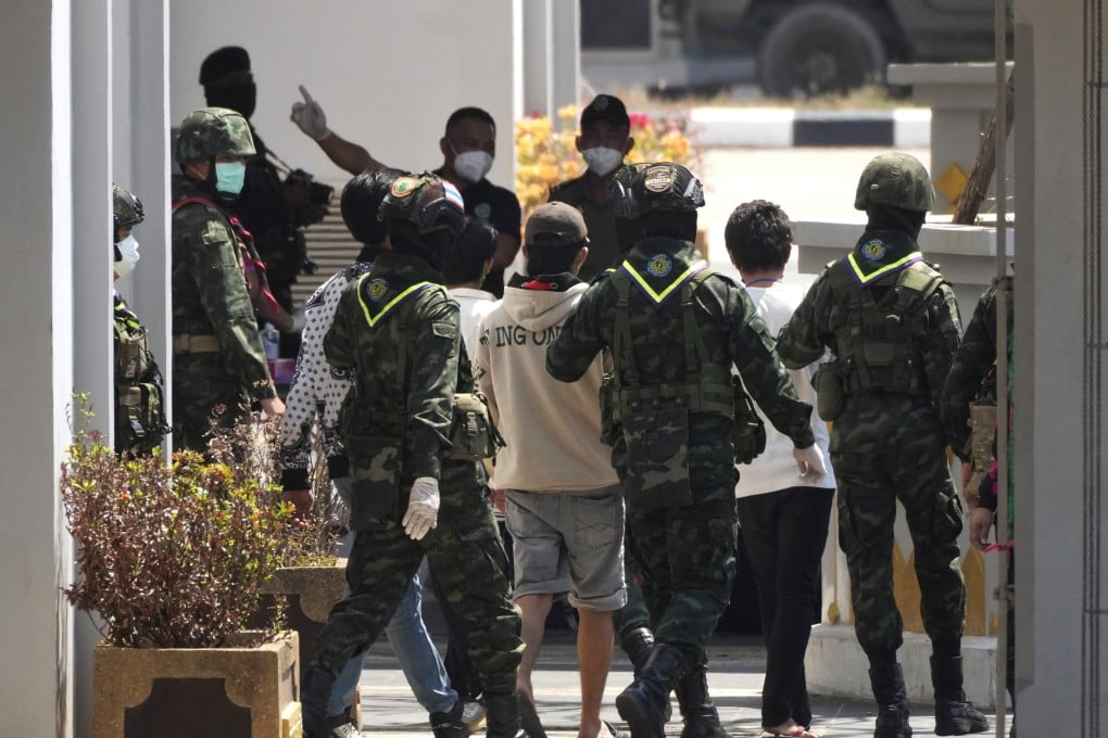 Thai soldiers in Mae Sot provide security for Indonesian nationals who are set to be repatriated after being forced to work at scam centres in eastern Myanmar. Photo: AP