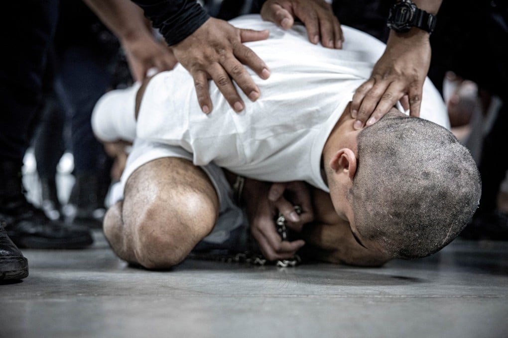 An alleged Venezuelan gang member who was deported to El Salvador by the US. Photo: Secretaria de Prensa de la Presidencia via Reuters
