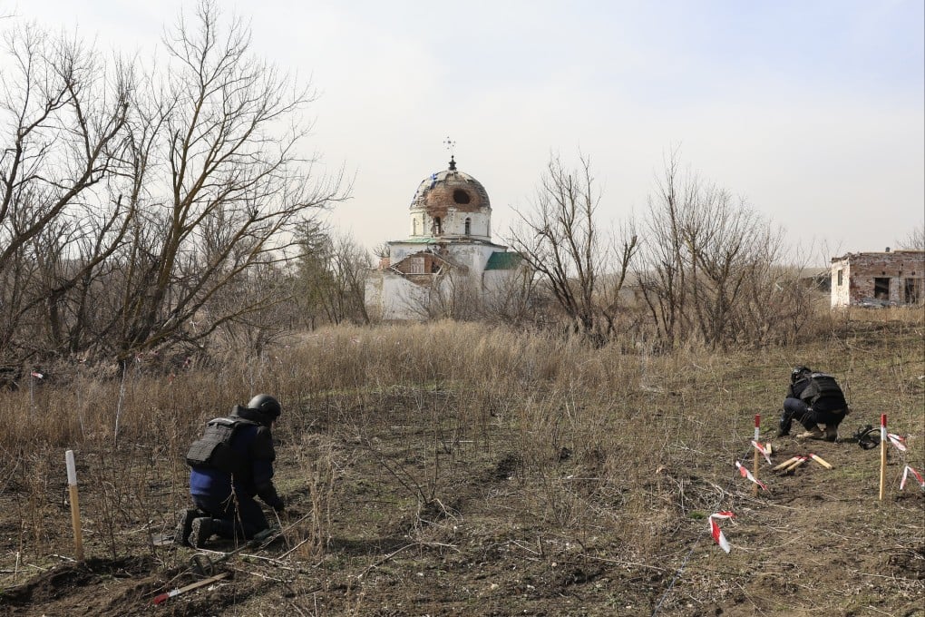 Ukrainian sappers at work during demining operations in the Kharkiv area, northeastern Ukraine on March 12, 2025. Quitting the 1997 treaty, which has been ratified or acceded to by more than 160 nations, will allow Poland and the three Baltic countries to start stockpiling and using landmines again. Photo: EPA-EFE