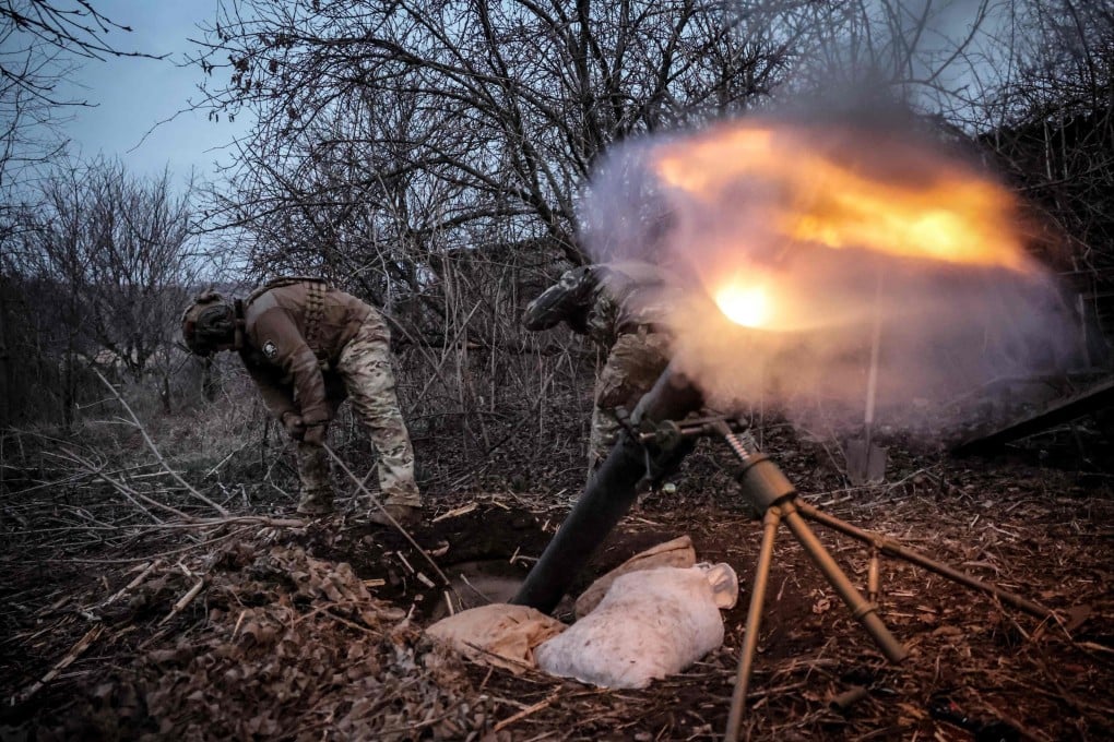 Ukrainian servicemen fire a 120mm mortar towards Russian positions at an undisclosed location near Chasiv Yar, Donetsk region, on Sunday. Photo: 24th Mechanised Brigade of Ukrainian Armed Forces/ AFP