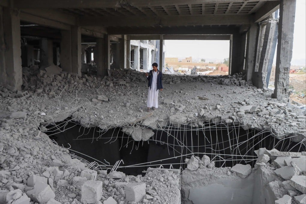 A Yemeni man inspects the damage in the Al-Rasul Al-Aazam cancer and oncology hospital’s unfinished building, a day after it was hit in a US strike in Yemen’s northern Saada province on March 25. Photo: AFP