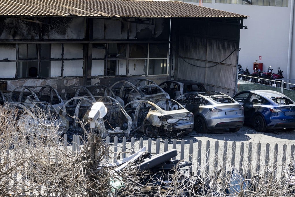 Burnt-out cars vandalised at a Tesla dealership on the outskirts of Rome, Italy on Monday. Photo: EPA-EFE