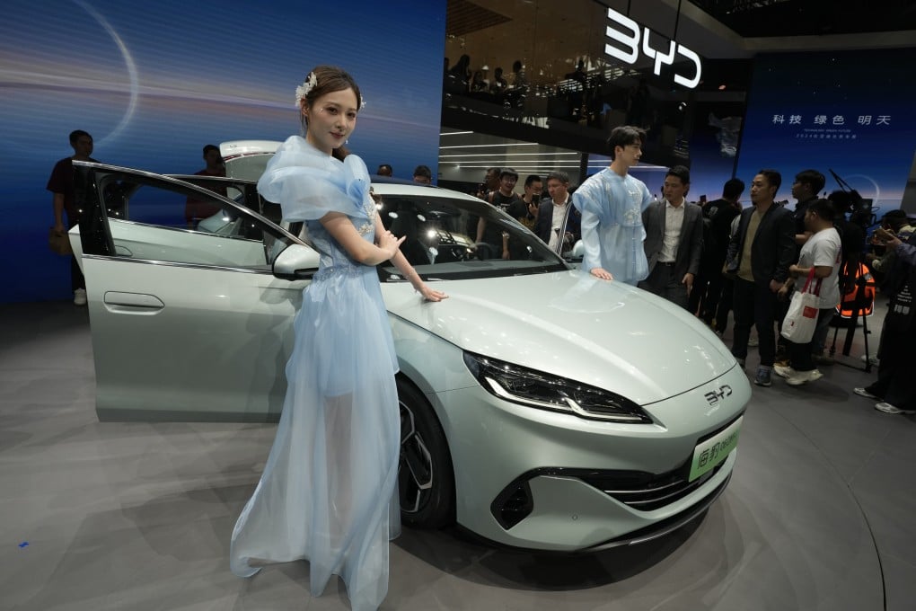 Models pose near the BYD Seal 06 Dmi unveiled during an autho show in Beijing, on April 25, 2024. Photo: AP