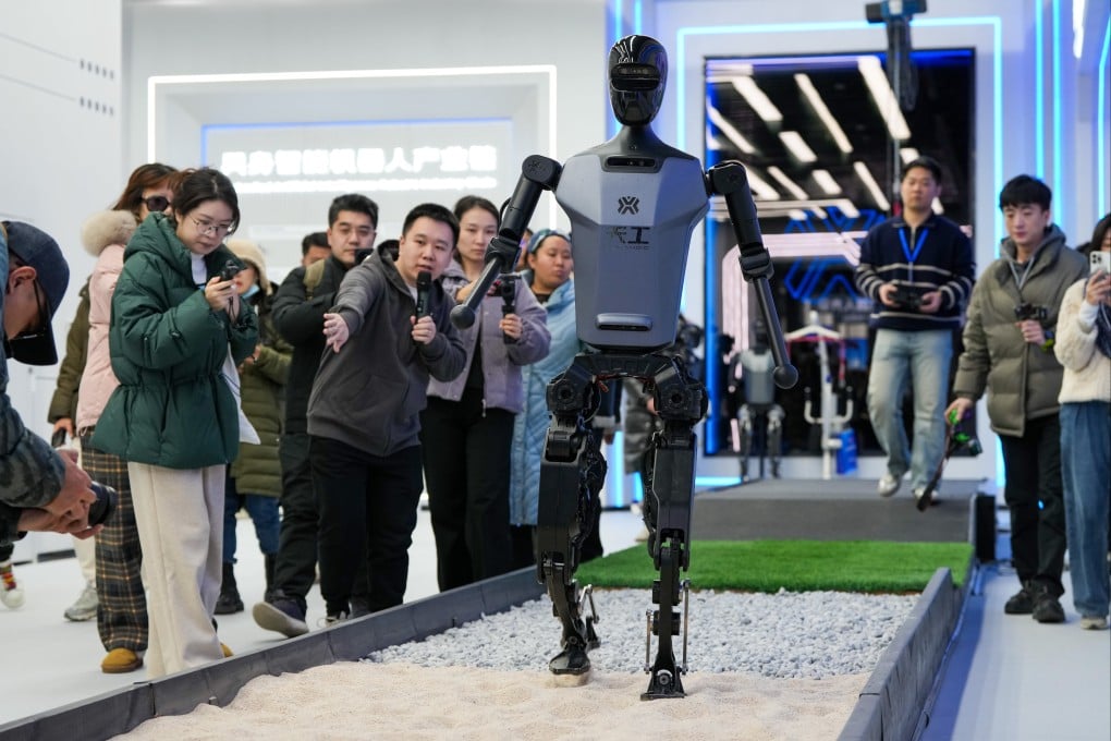 Visitors watch a Tiangong humanoid robot, developed by Beijing-based National and Local Co-built Embodied AI Robotics Innovation Center, at the Robot World in Beijing on February 24. Photo: Xinhua