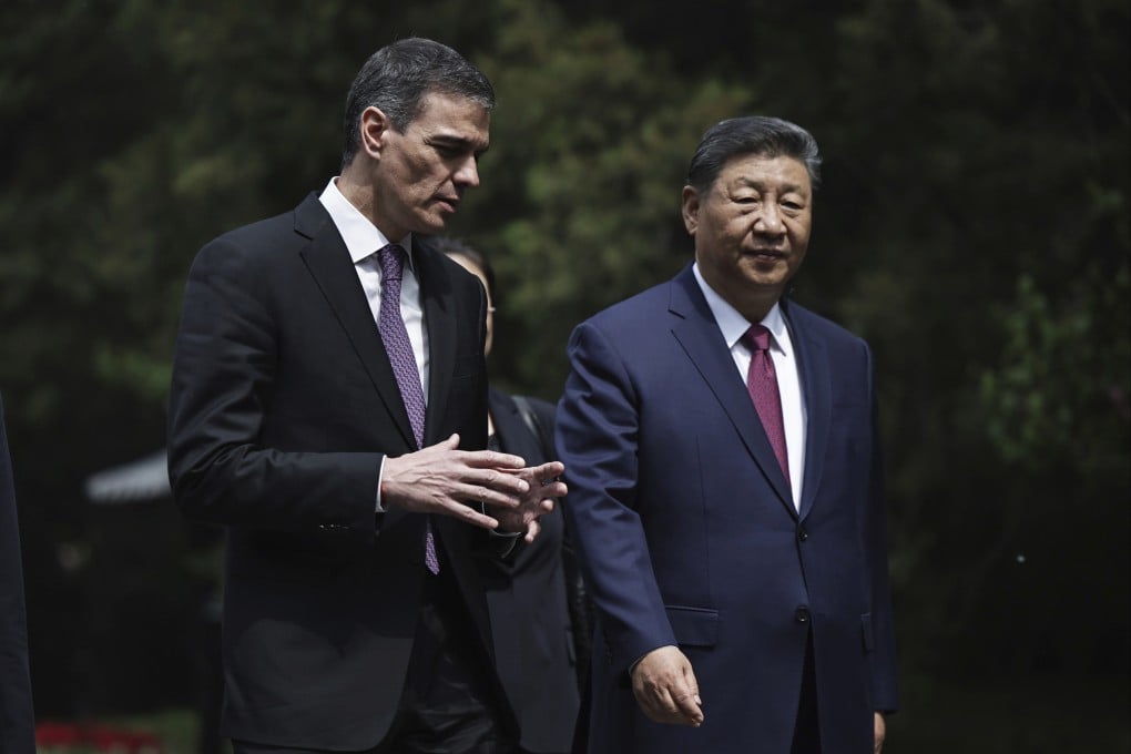 Xi Jinping (right) and Pedro Sanchez walk after a meeting in Beijing on Friday. Photo: AP