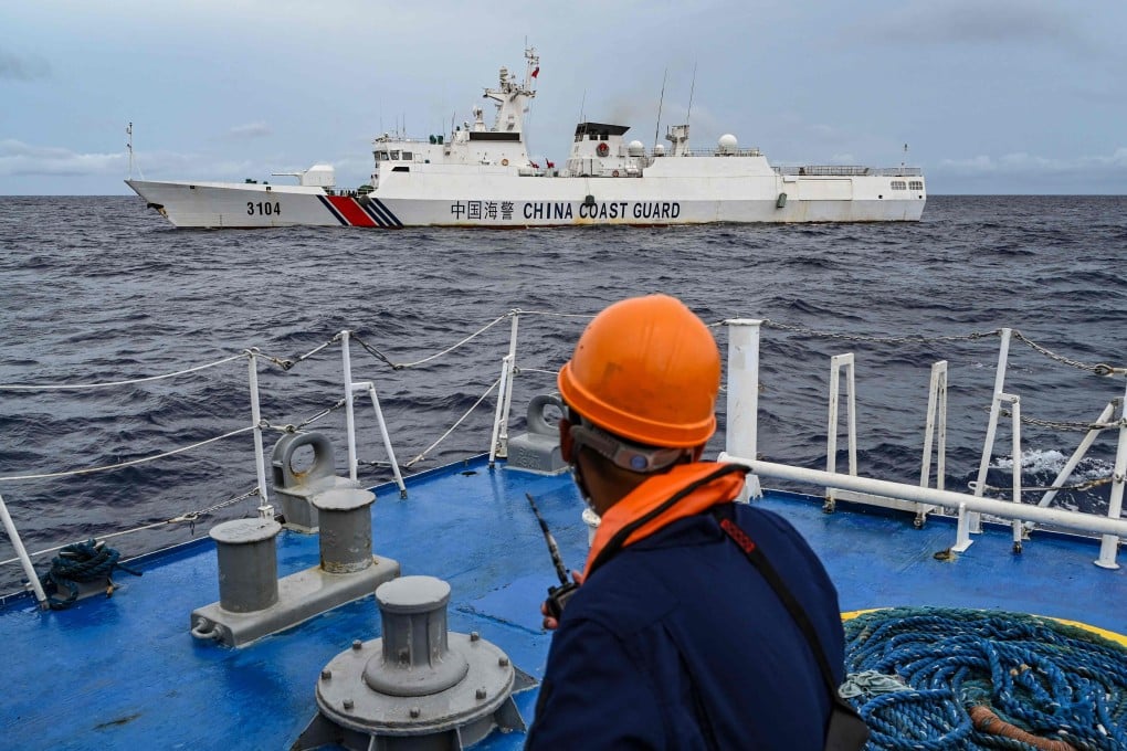 A China coastguard ship is seen from a Philippine coastguard vessel during a supply mission to Sabina Shoal in disputed waters of the South China Sea in 2024. Photo: AFP
