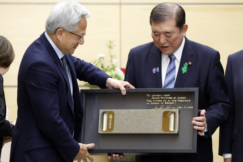 Japanese Prime Minister Shigeru Ishiba, right, receives a gift from Nvidia chief executive Jensen Huang at the start of their meeting in Tokyo on April 21, 2025. Photo: EPA-EFE