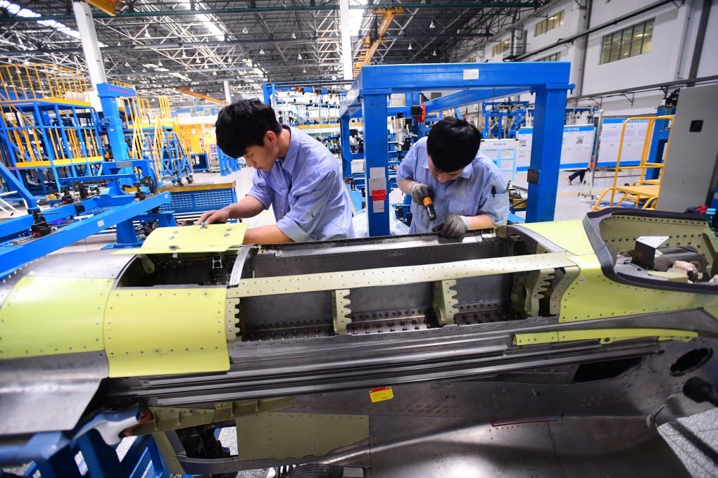 Workers assemble part of the engine assembly for China’s home-grown C919 passenger jet. One analyst says the C919 relies on American and other Western suppliers for the vast majority of its components. Photo: Reuters
