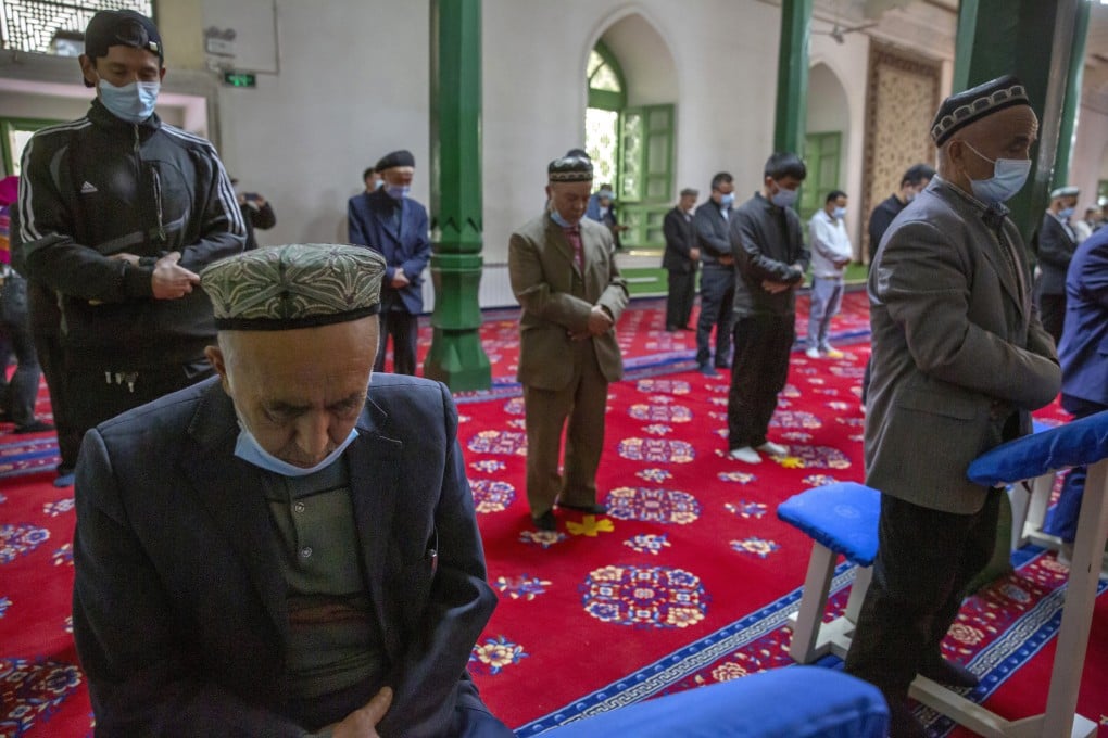 Men pray during services at a mosque in Kashgar, Xinjiang Uygur autonomous region in April 2021. The EU has sanctioned several Chinese officials over alleged human rights abuses in the far western Chinese region. Photo: AP