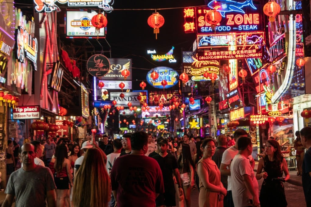 Tourists walk past go-go bars and night clubs in Pattaya, Thailand. Photo: Shutterstock