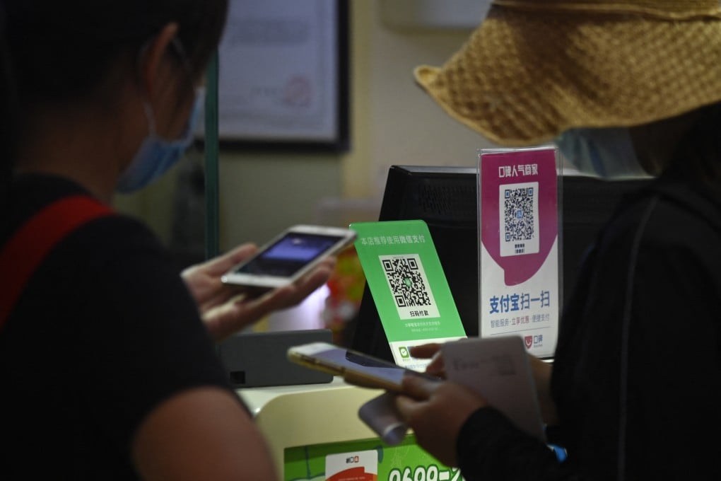 QR codes for WeChat Pay (left) and Alipay seen at a grocery store in Beijing on September 19, 2020. Photo: AFP