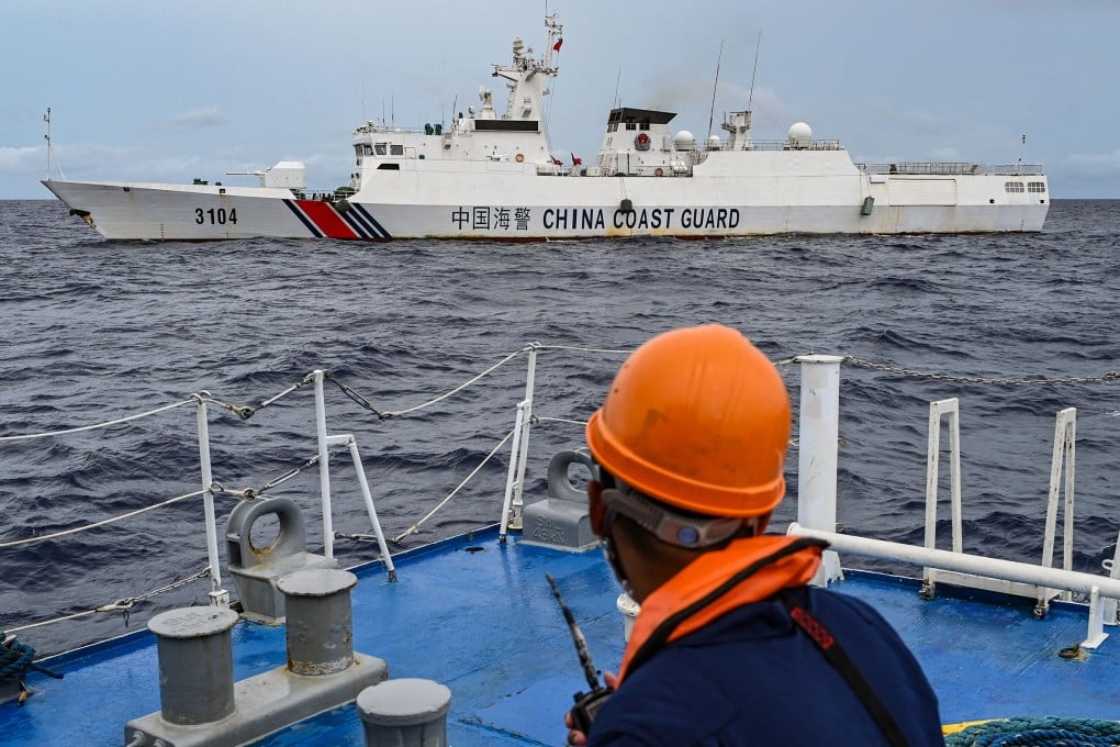 A China Coastguard ship is seen from the Philippine Coastguard vessel BRP Cabra during a supply mission to Sabina Shoal. Photo: AFP