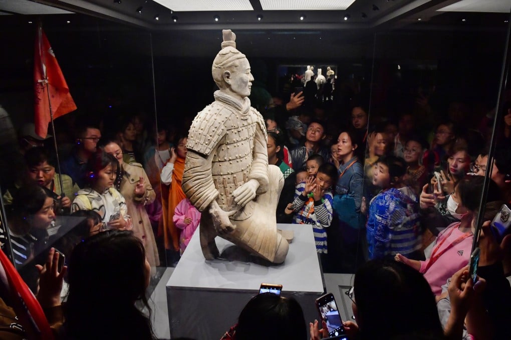 Tourists look at a Terracotta Army warrior in Xian, Shaanxi province, in 2023. In recent years, China has improved its system of museums and libraries while supporting a flourishing cultural industry. Photo: Xinhua