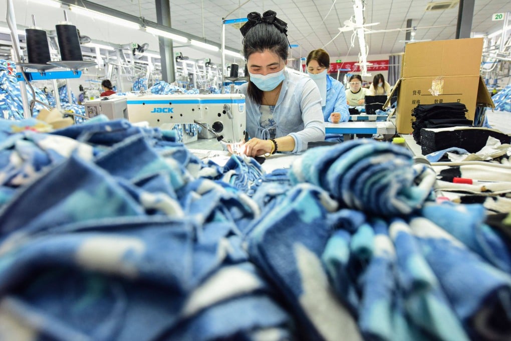 A worker stitches pyjamas for export at a clothing factory in eastern China. Chinese producers are rushing to front-load shipments following the announcement of a 90-day truce in the US-China trade war. Photo: AFP