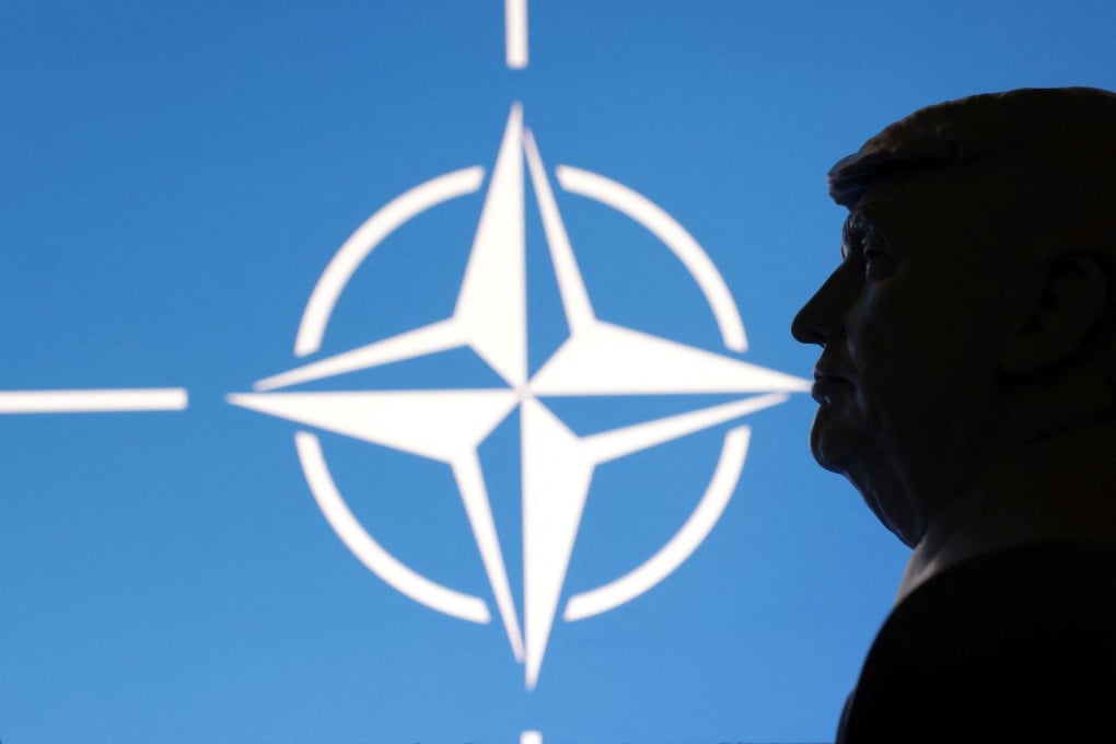 A 3D-printed model of US President Donald Trump with the Nato logo in the background. Photo: Reuters