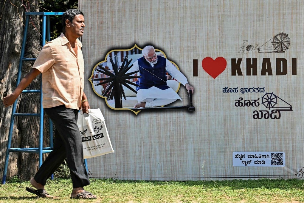 A poster shows India’s Prime Minister Narendra Modi promoting a trade fair in Bengaluru. Indian textile mills are facing stiff competition from their Chinese rivals. Photo: AFP