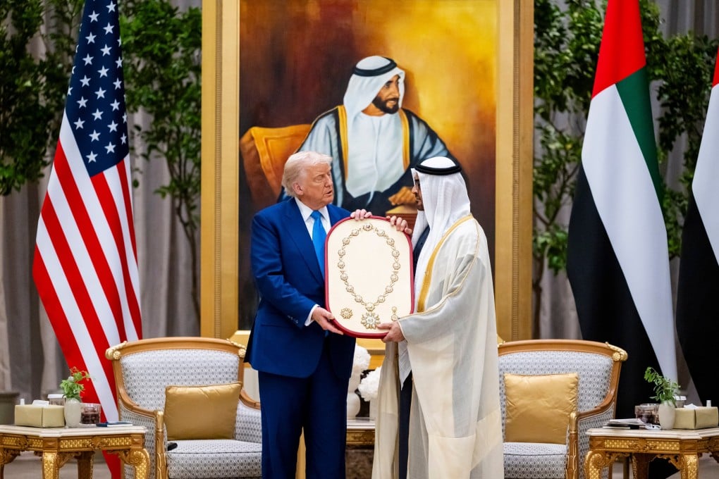 Sheikh Mohamed bin Zayed Al Nahyan, President of the United Arab Emirates and Ruler of Abu Dhabi, right, presents the Order of Zayed Medal to US President Donald Trump in Abu Dhabi, UAE on Thursday. Photo: EPA-EFE / UAE Presidential Court / Handout