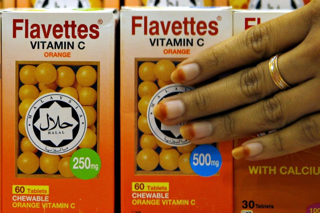 Vitamin C bottles carry a halal decal, assuring the product was prepared according to proper Muslim rites. Photo: AFP