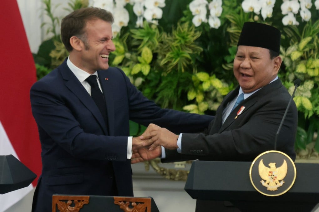 France’s President Emmanuel Macron (left) laughs with Indonesian President Prabowo Subianto at a joint press conference in Jakarta, Indonesia on Wednesday. Photo: EPA-EFE