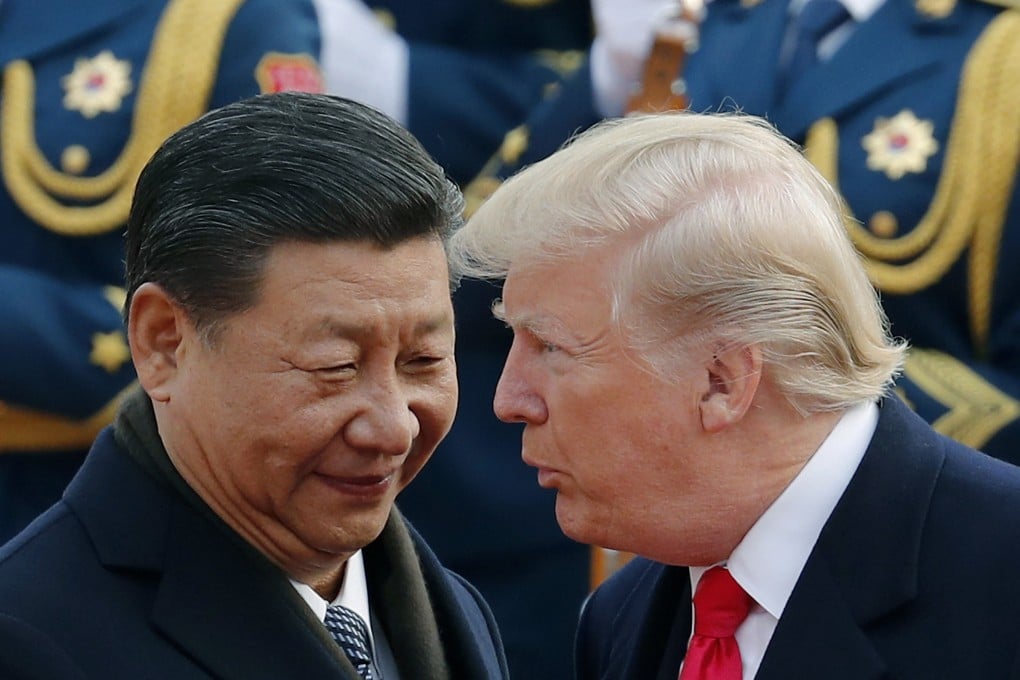 FILE - President Donald Trump, right, talks with China’s President Xi Jinping during a welcome ceremony at the Great Hall of the People in Beijing, Nov. 9, 2017. (AP Photo/Andy Wong, File)