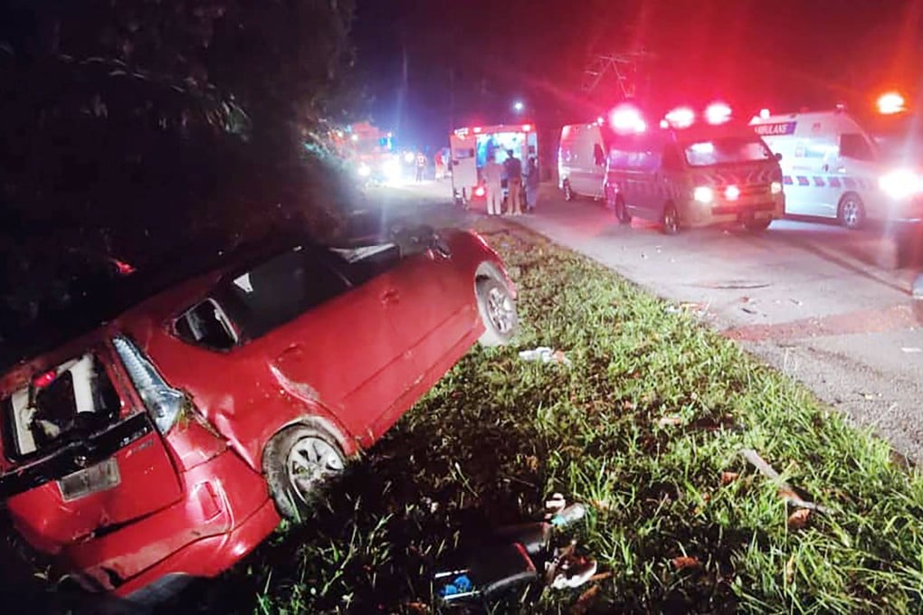 An accident scene after a minivan collided with a bus in Malaysia. Photo: Perak Fire and Rescue Department/AFP