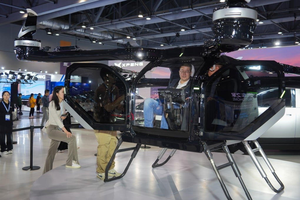 Visitors at Xpeng’s booth at the Hong Kong International Automotive and Supply Chain Expo on Thursday. Photo: Eugene Lee