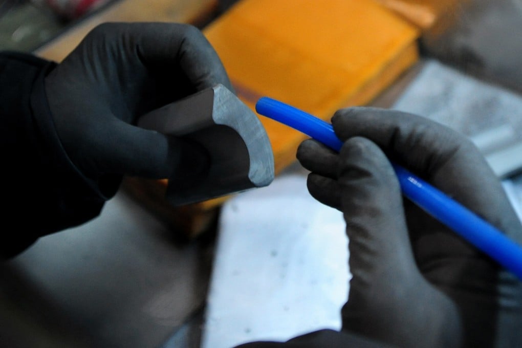 A worker cleans a semi-finished product that consists of rubidium, iron and boron in north China’s Inner Mongolia autonomous region in October 2010. China is a major rubidium producer, but its industry relies heavily on imported ores, mostly from Canada. Photo: TNS