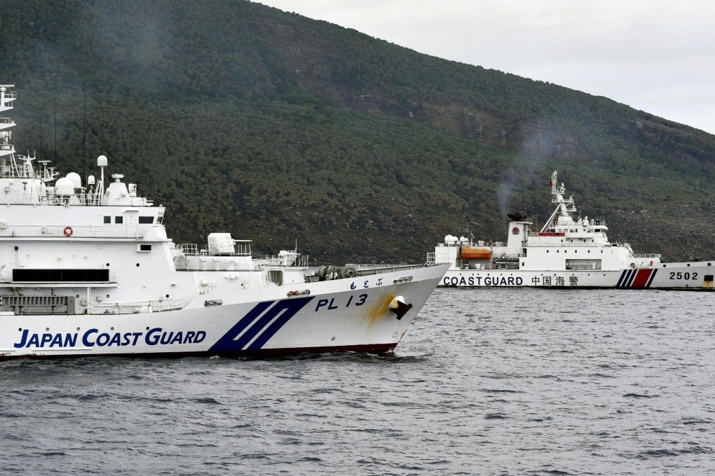 Chinese and Japanese coastguard vessels sail near the Diaoyu Islands in the East China Sea in April. Photo: Kyodo via Reuters