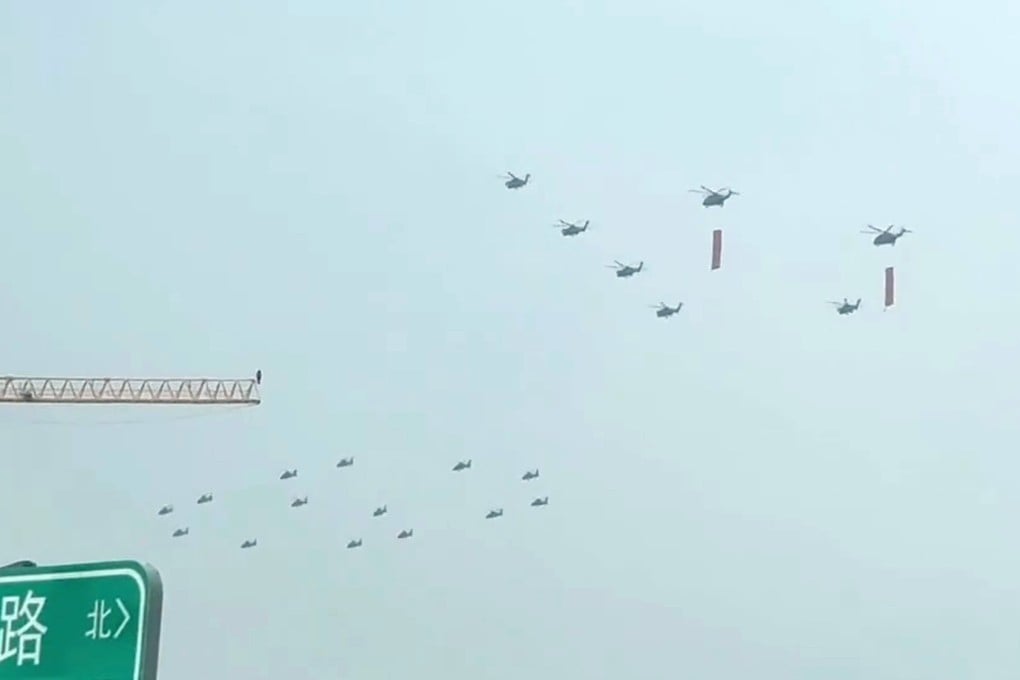 A clip posted to RedNote purportedly shows PLA helicopters flying in formation, some of them carrying red flags. Photo: Handout