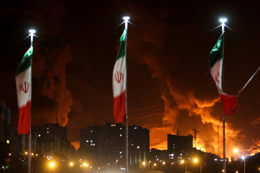 Smoke rises above an oil depot in the Iranian capital Tehran after an Israeli attack on Sunday. Photo: West Asia News Agency via Reuters