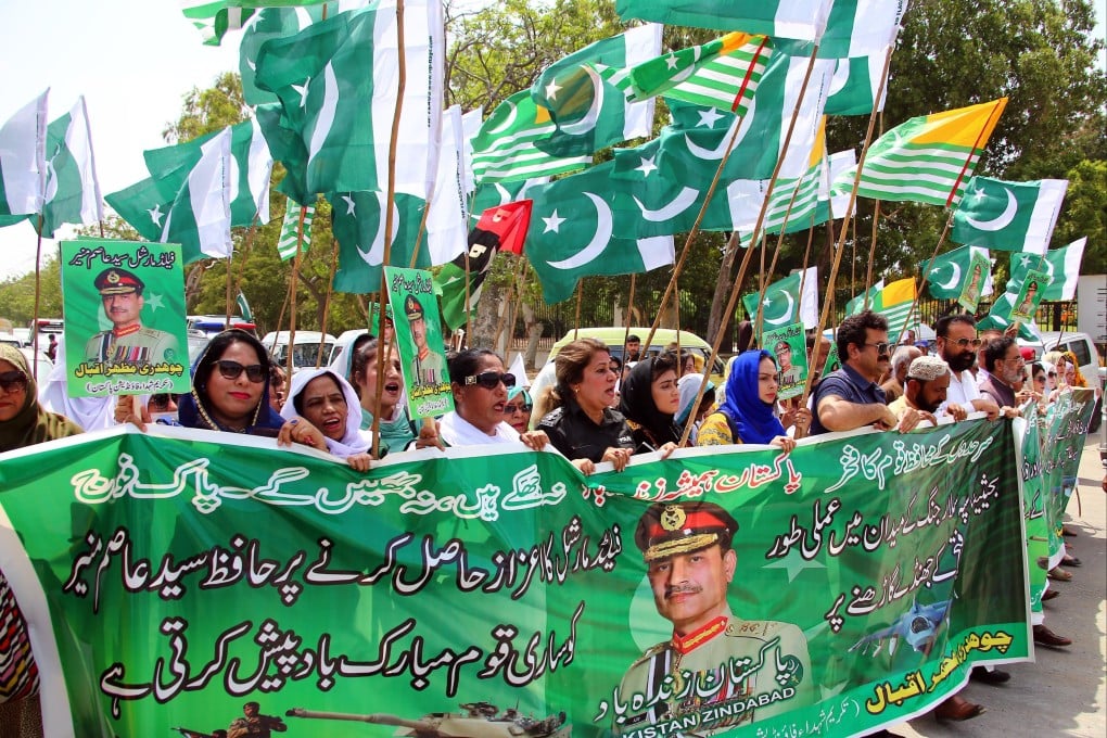 Pakistani activists hold portraits of Pakistani Army Chief General Asim Munir during a rally in Karachi on May 21. Munir’s recent meeting with US President Donald Trump has raised concerns in India. Photo: EPA-EFE
