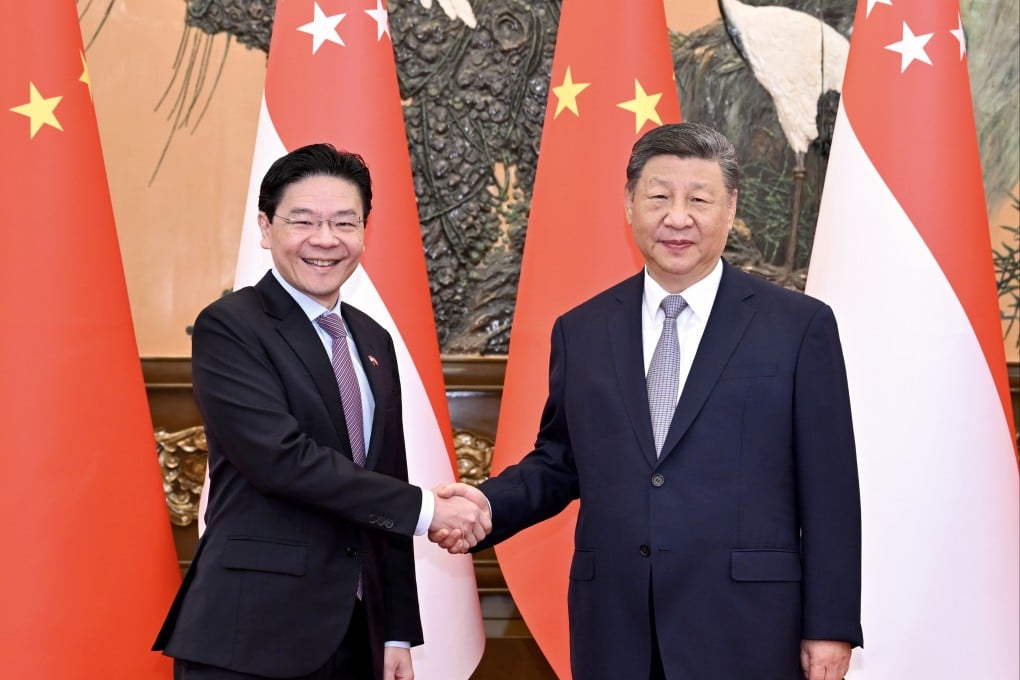 Chinese President Xi Jinping (right) met with Singaporean Prime Minister Lawrence Wong on Tuesday in Beijing. It is Wong’s first trip to China since he became prime minister in May last year. Photo: Xinhua