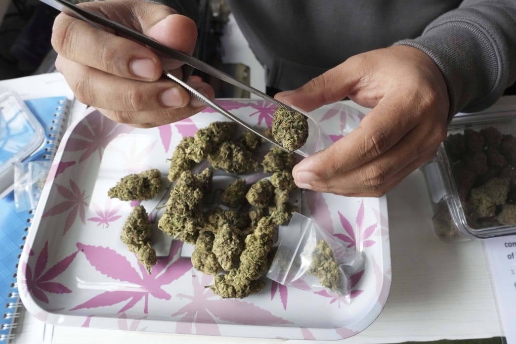 A marijuana flower bud being prepared for a customer at a cannabis shop in Bangkok. Photo: AP