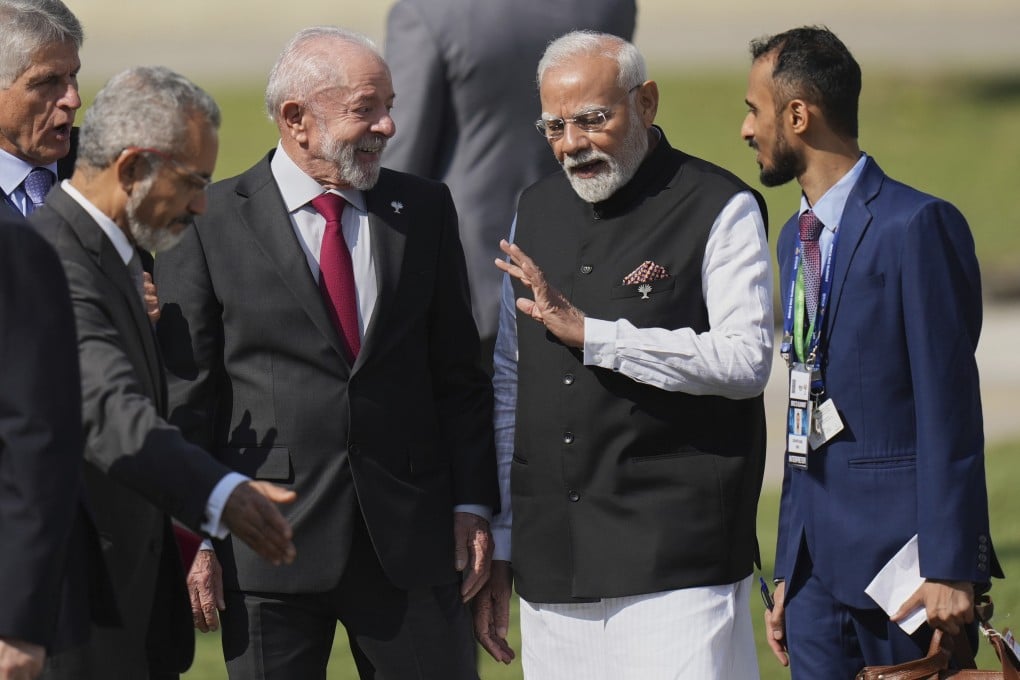 India’s Prime Minister Narendra Modi, second from right, chats with Brazilian President Luiz Inacio Lula da Silva during the 17th annual BRICS summit in Rio de Janeiro, Sunday, July 6, 2025. (AP Photo/Silvia Izquierdo)