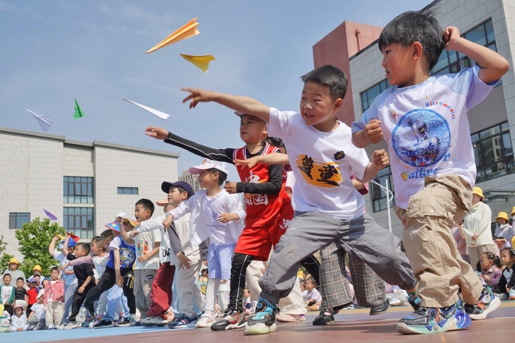 Children fly paper planes at the Second Experimental Kindergarten in Yantai High-tech Zone, in east China’s Shandong province, in May last year. Photo: CFOTO/Future Publishing via Getty Images