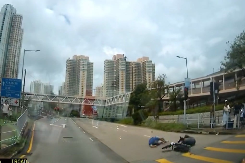A screengrab of footage circulating online shows the pedestrian (in blue top) and the rider both lying on the road. Photo: Facebook/Steve Yeung