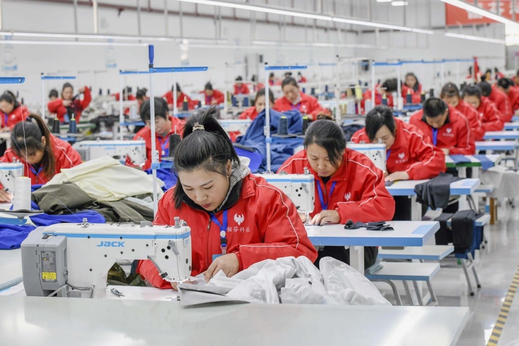 Workers sew apparel at a garment workshop in Zunhua, north China’s Hebei Province. Photo: Xinhua
