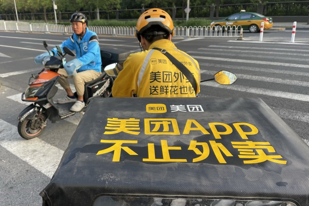 Delivery couriers cross paths in Beijing on September 1, 2023. Photo: Simon Song