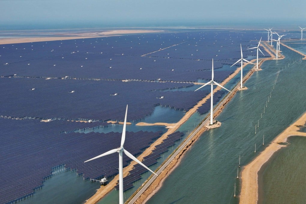 Solar panels and wind turbines at a new energy power generation project in Binzhou, in China’s eastern Shandong province. Photo: AFP