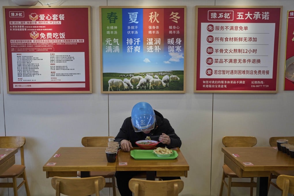Liu Lijie, a food delivery rider from Ele.me eats his meal at Yushiji restaurant in Beijing on March 18, 2025. Photo: AP